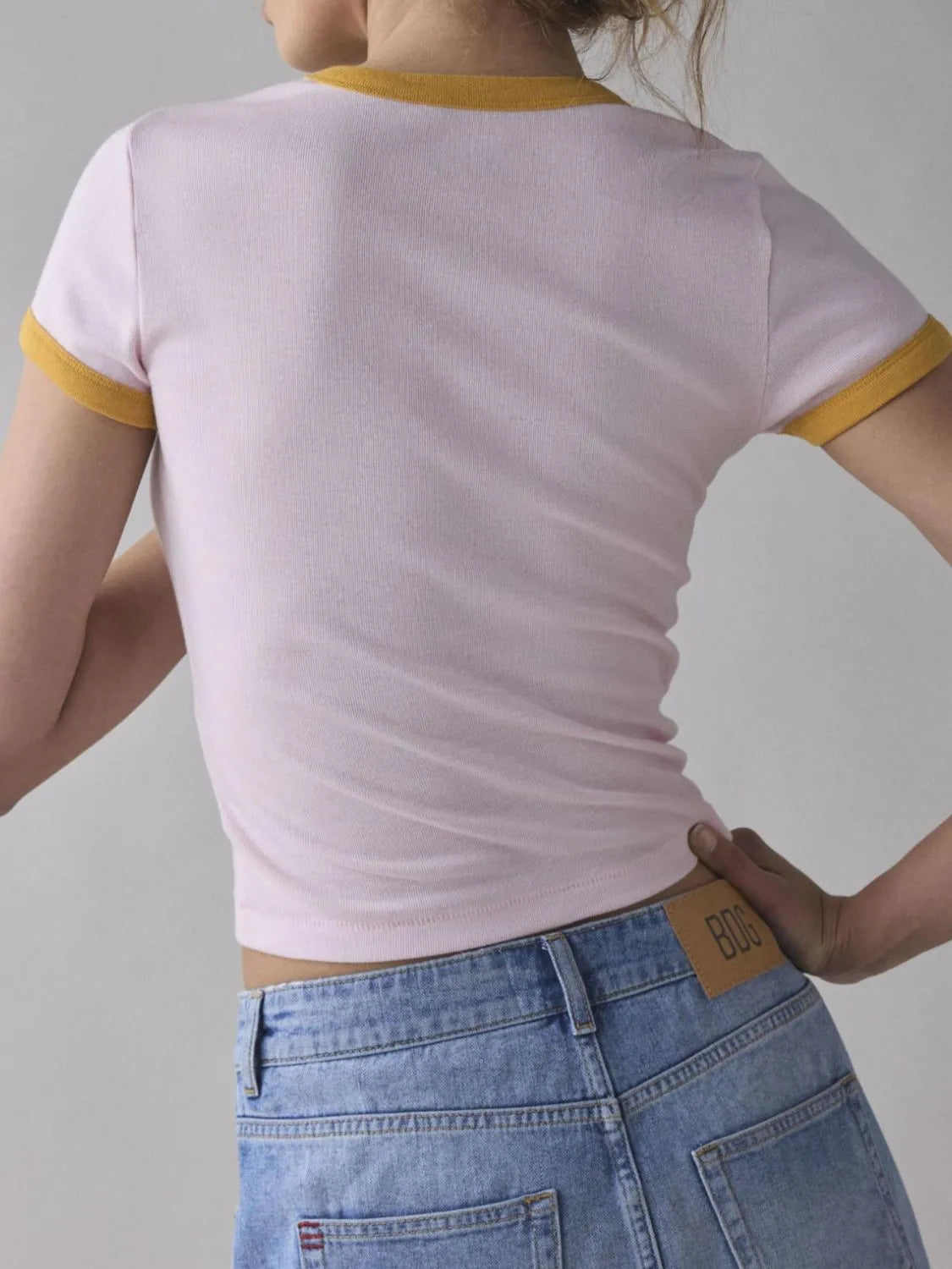 Soft baby pink ringer tee with yellow accents