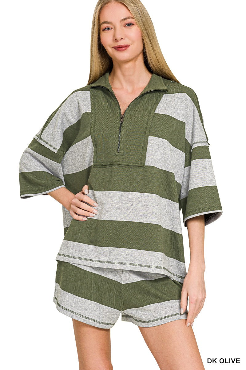 Woman wearing a green and gray striped outfit on a white background