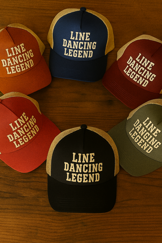 Multiple Line Dancing Legend hats in different colors arranged on a rustic wooden table