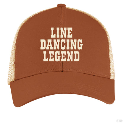 A light brown and tan trucker hat with cream "Line Dancing Legend" text, styled for country music lovers and line dancers.