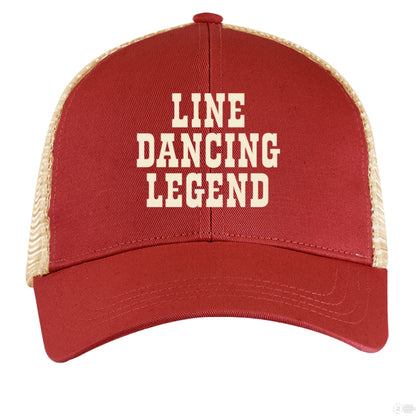 A rust red and tan trucker hat with cream "Line Dancing Legend" text, styled for country music lovers and line dancers.