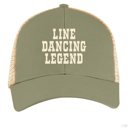 A sage green and tan trucker hat with cream "Line Dancing Legend" text, styled for country music lovers and line dancers.